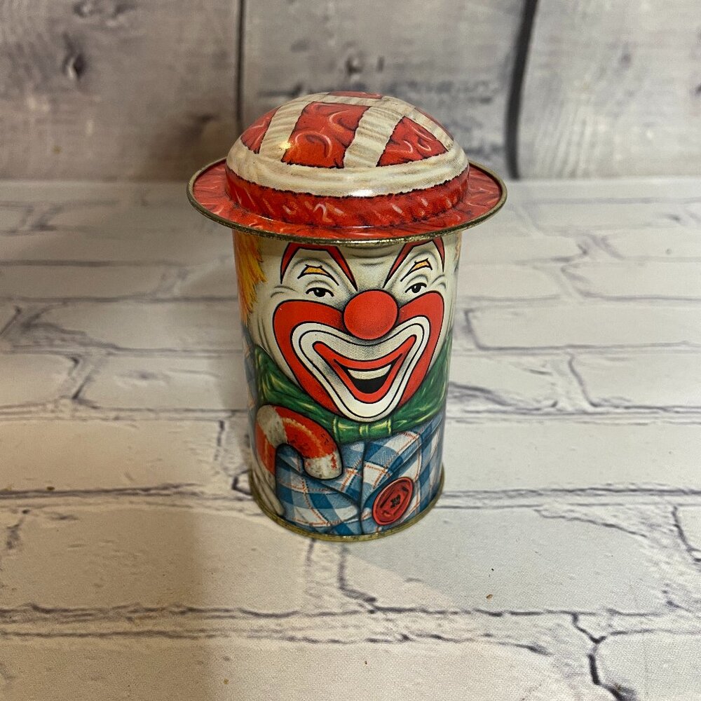 VINTAGE METAL TIN CAP TINS 4" CANDY CONTAINER HAPPY CLOWN